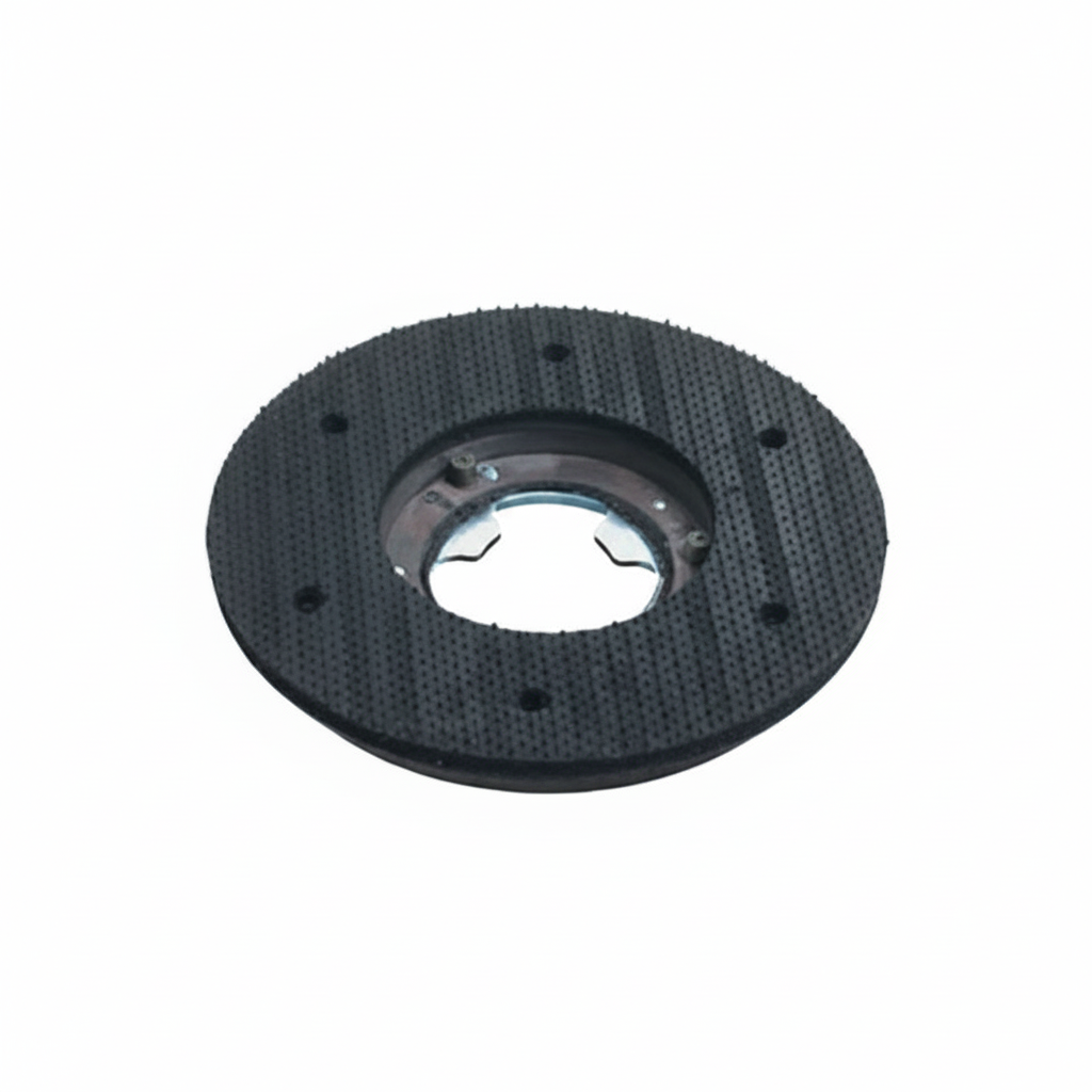 Black circular component with textured surface on a white background