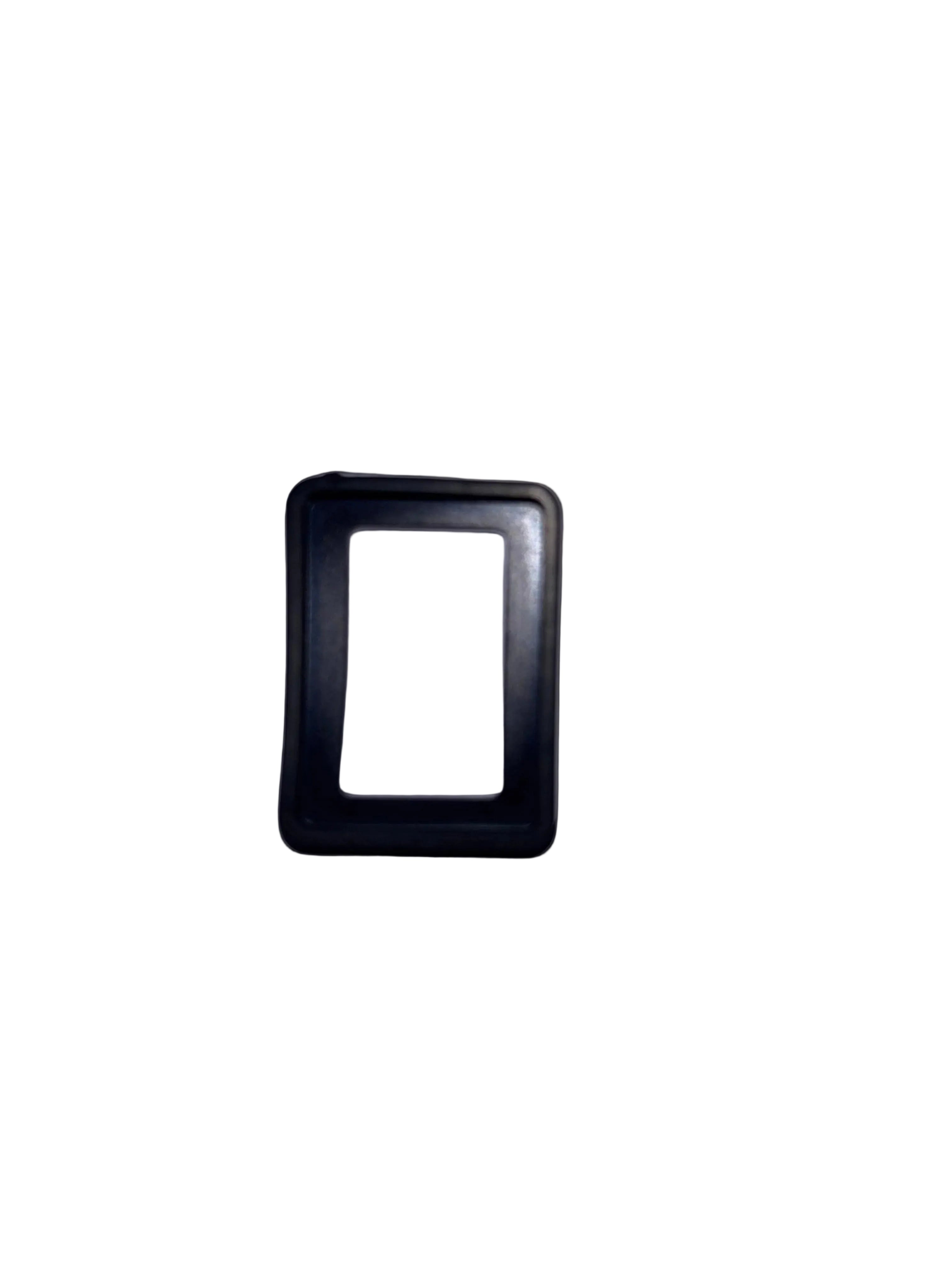 Black rectangular object on a light gray background